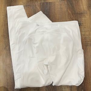 Lululemon size 6 white leggings. Worn twice. Tiny spot on top.